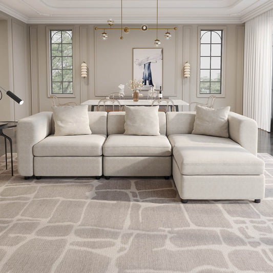 Guyii Beige Velvet Sectional Sofa, Modern Oversized 4-Seater Couch with 3 Pillows and 1 Storage Ottoman